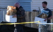 Federal agents with the Bureau of Alcohol, Tobacco, Firearms and Explosives (ATF) remove s...