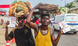 Two men display fliers during an awareness walk in commemoration of 2026 World TB (Tubercu...
