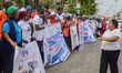 Participants take part in an awareness walk in commemoration of 2026 World TB (Tuberculosi...