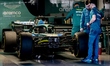 A team works on the car of Formula 1 driver Lance Stroll of the Aston Martin Aramco Formul...