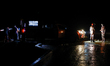 Fire service personnel stand at the accident site following a ferry terminal incident wher...