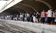 Passengers crowd the concourse at Kamalapur Railway Station as they return to Dhaka, Bangl...