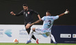 Jordanian player Mohammad Abuhaseesh competes with Costa Rican player Mitchel for the ball...
