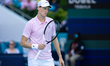 Jannik Sinner of Italy gestures with his racket during his quarterfinal match against Fran...