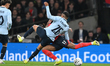 Rodrigo Aguirre of Uruguay and Noni Madueke of England challenge for the ball during the I...