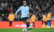 Ronald Araujo of Uruguay passes the ball during the international friendly match between E...