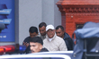 Former Nepali Prime Minister KP Sharma Oli is escorted by police personnel from the Distri...