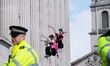 Greenpeace activists climb the pillars of the National Gallery in London, United Kingdom,...