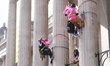 Greenpeace activists climb the pillars of the National Gallery in London, United Kingdom,...