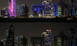 A combo image shows a general view of the West Bay skyline in Doha before (top) and after...