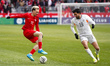 Liam Millar #11 of Canada and Michael Egiil Ellertsson #19 of Iceland compete for the ball...