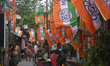 Party flags of the TMC and BJP are visible in a slum in Kolkata, India, ahead of the West...