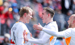 Iceland striker Orri Steinn Oskarsson (#9) celebrates his first goal with teammates during...