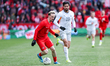 Team Canada midfielder Liam Millar #11 (left) dribbles the ball during an international fr...