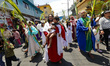 A person portrays Jesus during the Palm Sunday reenactment in the Tenorios neighborhood in...