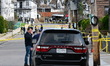 Members of the FBI Evidence Response Team collect evidence following the discovery of a su...