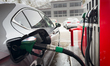 A fuel nozzle dispenses unleaded 95 petrol into a passenger car at an ORLEN fuel station i...