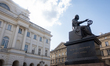 The Nicolaus Copernicus Monument stands with Staszic Palace in the background on Krakowski...