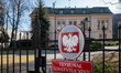 An official Constitutional Tribunal plaque with the Polish eagle emblem is seen on the fen...