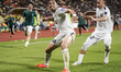 The Turkmenistan football team celebrates after scoring the equalizing goal during the AFC...
