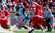 Charlie Iler of the Johns Hopkins Blue Jays evades Ben Mckelvy of the Rutgers Scarlet Knig...