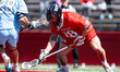 Marco Wimmershoff of the Rutgers Scarlet Knights retrieves a ground ball during an NCAA me...
