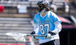 Oran Gelinas of the Johns Hopkins Blue Jays holds the ball during an NCAA men's lacrosse g...