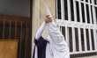 A Nazarene from the Passion brotherhood prepares on the evening of Holy Tuesday in Santand...