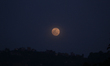 A full moon rises over Bhaktapur, Nepal, on March 1, 2026. 