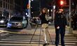 Members of the NYPD Crime Scene Unit collect a blood-stained hat on Humboldt Street after...