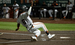 San Jose Giants' infielder, Dario Reynoso (6), slides into home during the Battle of the B...