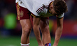 Fermin of Spain adjusts his shin guard during the international friendly match between Spa...