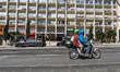 People ride an electric motorbike in Lisbon, Portugal, on April 2, 2026. Urban mobility in...