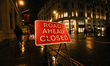 A road ahead closed sign is seen on the street in London, United Kingdom, on February 16,...