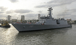 Indian naval vessel IOS Sagar (P57) is assisted by a tugboat during its ceremonial flag-of...