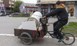 A man on a cart collects discarded items on Bulevar Oslobodjenja in Novi Sad, Serbia, on A...