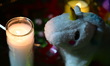 A vigil with teddy bears, flowers, and candles is held one day after a 7-month-old girl, i...