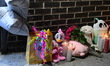 A vigil with teddy bears, flowers, and candles is held one day after a 7-month-old girl, i...