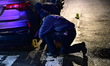 Members of the NYPD Crime Scene Unit work at the scene where a 22-year-old man, identified...