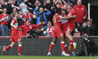 Dael Fry of Middlesbrough celebrates with his teammates after scoring the first goal durin...