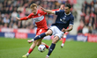 Tommy Conway of Middlesbrough FC closes down Tristan Crama of Millwall FC during the Sky B...