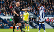 Referee Robert Madley gestures as Josh Maja of West Bromwich Albion waits to take a penalt...
