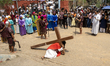 Catholic devotees participate in a re-enactment of the crucifixion of Jesus Christ during...