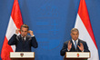 Hungarian Prime Minister Viktor Orban(R) and Austrian Chancellor Christian Kern attend a j...