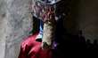 A Matacuero, a masked figure, inside a chapel in eastern Morelos State, Mexico, prepares t...