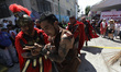 A penitent participates in the 40th anniversary of the Passion of Christ in the Tenorios n...