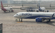 Indian aircraft are seen parked on the runway at Indira Gandhi International Airport on Ap...