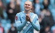 Erling Haaland of Manchester City celebrates with fans after a 4-0 win during the Emirates...