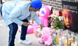 A vigil with teddy bears, flowers, and candles is held for 7-month-old Kaori Patterson-Moo...