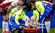 Jerdy Schouten of PSV Eindhoven is carried off the field on a stretcher after sustaining a...